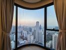 Modern living room with panoramic city view through large bay window