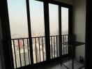 High-rise apartment interior with city view through large windows