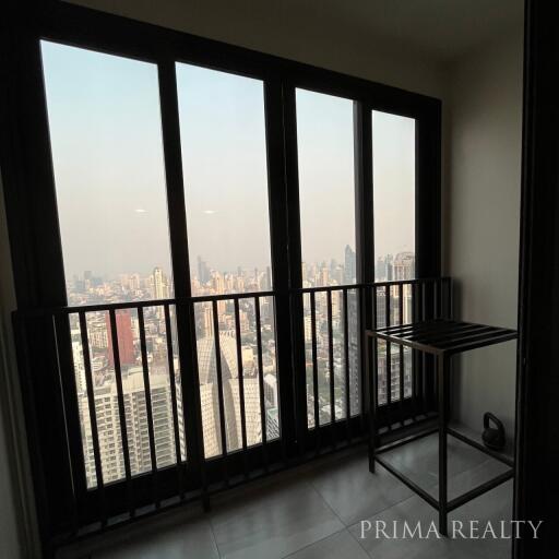 High-rise apartment interior with city view through large windows