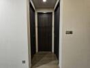 Modern hallway with sliding door and wooden floors