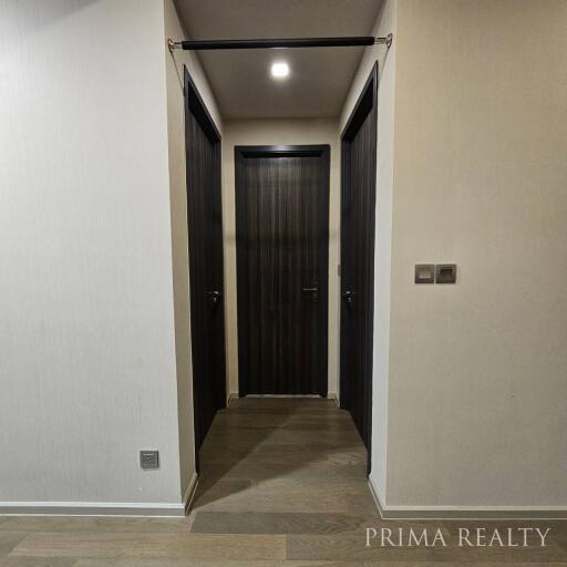 Modern hallway with sliding door and wooden floors