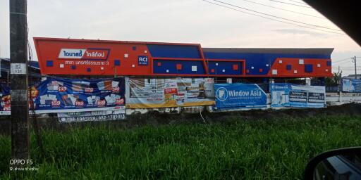 Exterior view of a commercial property with advertising banners