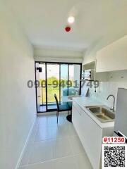 Compact modern kitchen with dining area and access to outdoor space