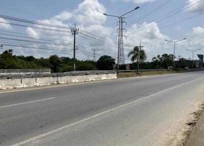 view of a large street with utility poles and clear skies