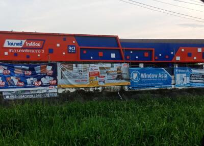 Colorful train cars by the roadside displayed as an advertisement