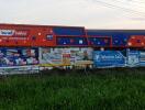 Colorful train cars by the roadside displayed as an advertisement