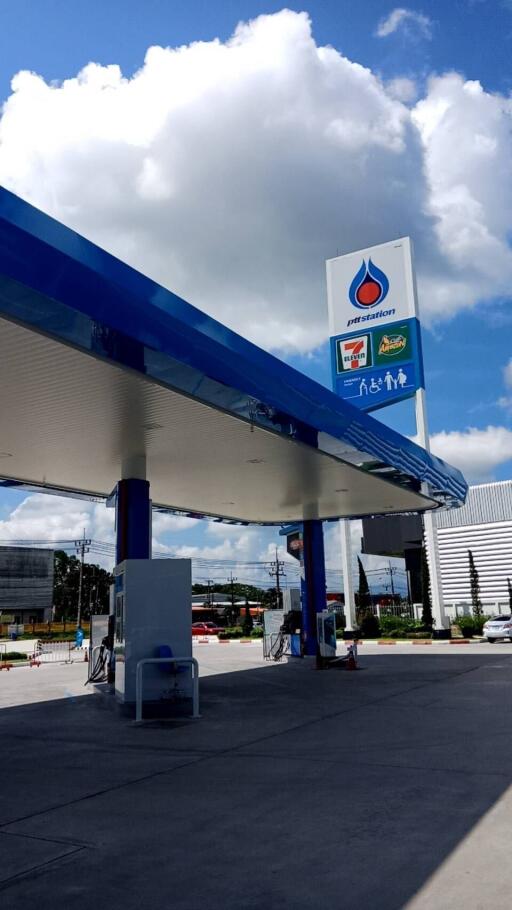 Exterior view of a gas station under a clear blue sky