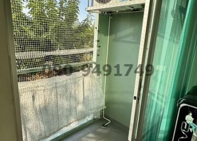 Small balcony with an air conditioning unit and safety net