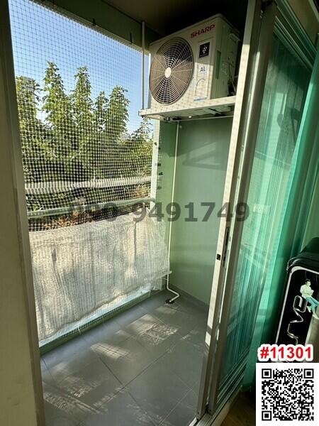 Small balcony with an air conditioning unit and safety net