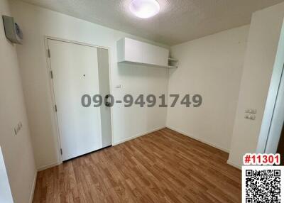 Spacious bedroom with laminate flooring and built-in storage