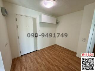 Spacious bedroom with laminate flooring and built-in storage
