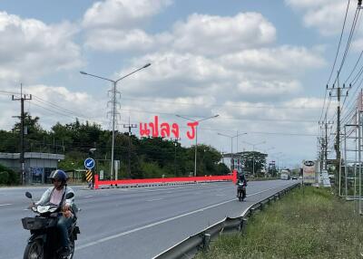 Roadside view with vehicles and signage