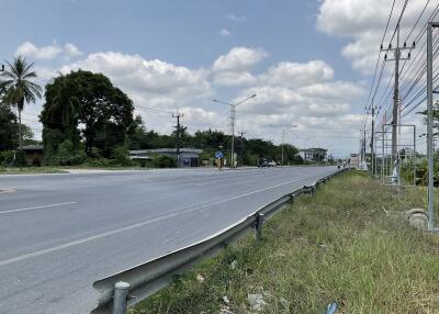 Empty road with clear skies near potential real estate development area