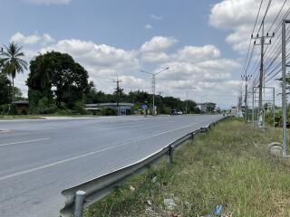 Empty road with clear skies near potential real estate development area