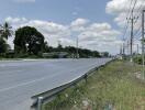 Empty road with clear skies near potential real estate development area