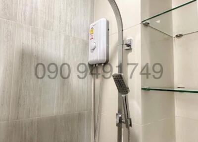 Modern bathroom with wall-mounted shower and water heater