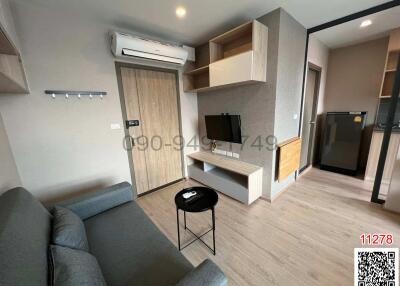 Modern living room with entertainment unit and comfortable seating
