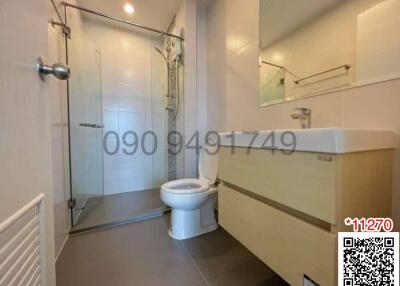 Modern bathroom interior with glass shower cubicle