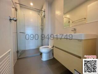 Modern bathroom interior with glass shower cubicle