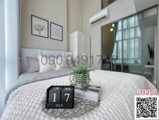 Modern bedroom with a comfortable bed and simplistic decor