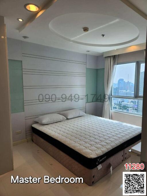Spacious master bedroom with modern design and city view