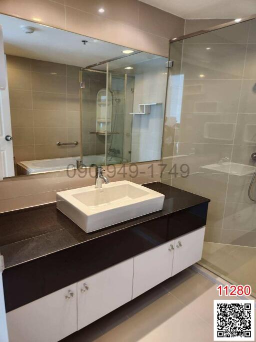 Modern bathroom with glass shower and vanity