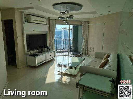Spacious and well-lit living room with balcony access