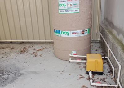 Water tank installed next to a building