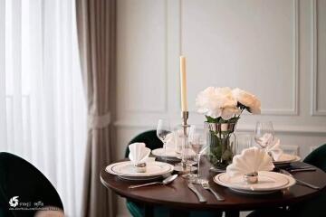 Elegant dining area with set table and floral decoration