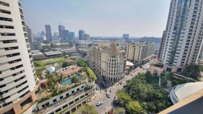 Panoramic city view from a high-rise apartment balcony