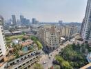 Panoramic city view from a high-rise apartment balcony