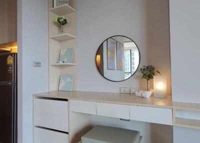 Cozy bedroom with modern vanity, ample lighting and hardwood floor