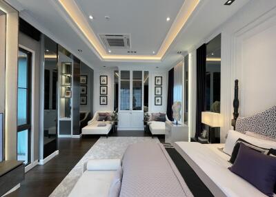 Spacious modern bedroom with ambient lighting and elegant decor