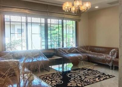 Elegant living room with modern lighting and large windows