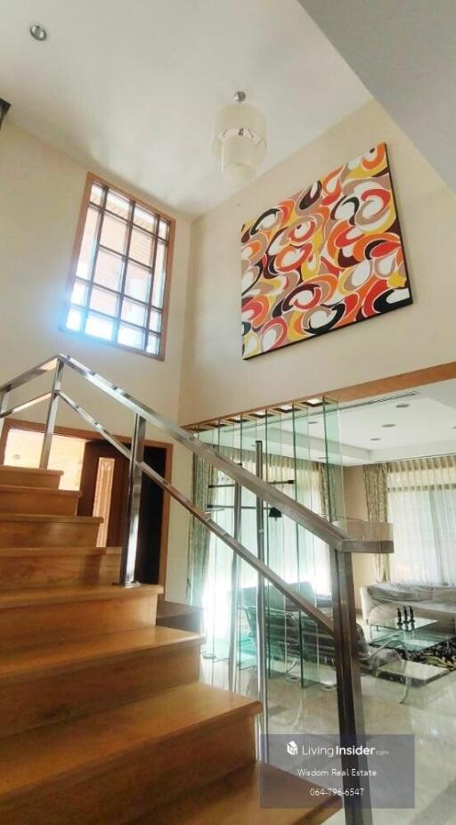 Modern home interior with staircase and high ceiling