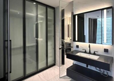 Modern bathroom with glass shower enclosure and double vanity