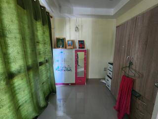 Bright bedroom with wardrobe and decorations