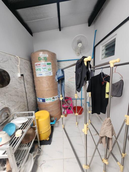 Utility room with laundry and storage in a residential property