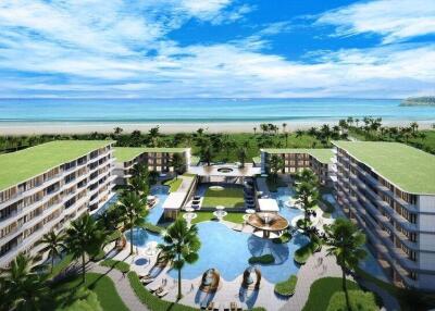 Luxurious beachfront residential complex with swimming pool and palm trees