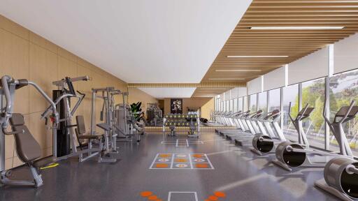 Modern gym facility with cardio and weight machines in a well-lit space