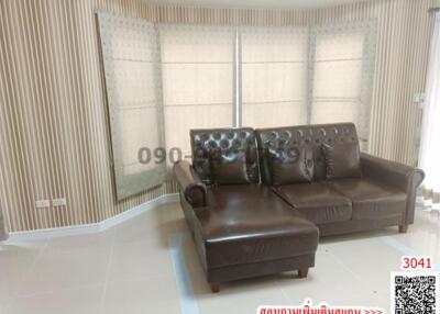 Spacious and elegantly furnished living room with natural light