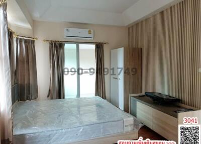 Spacious bedroom with air conditioning and natural light