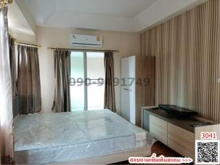 Spacious bedroom with air conditioning and natural light