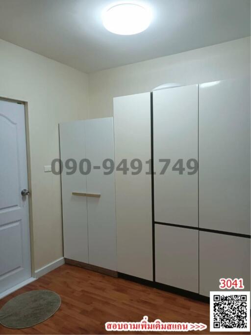 Compact bedroom with built-in wardrobe and parquet flooring