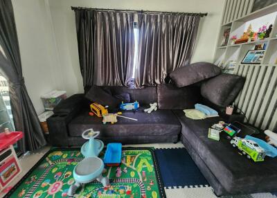 Spacious living room with play area for children