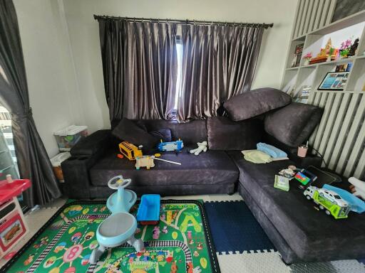 Spacious living room with play area for children