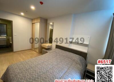 Spacious modern bedroom with a large bed and ample lighting