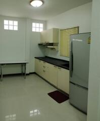 Spacious and clean kitchen interior with modern appliances