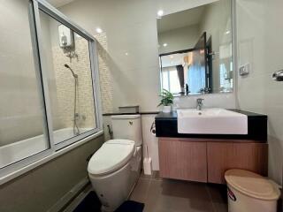 Modern bathroom interior with shower and large mirror