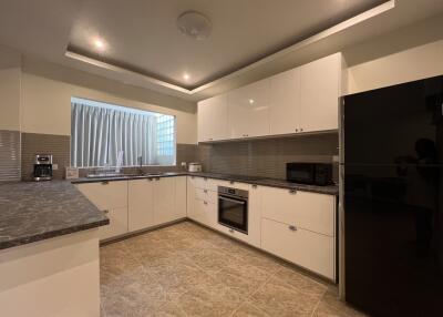 Modern kitchen with fitted appliances and ample countertop space